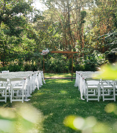 Chairs and an altar wait expectantly for the wedding party to arrive